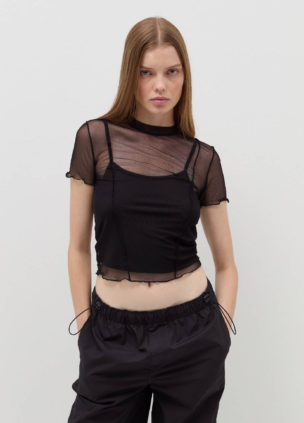 B. ANGEL T-shirt crop in mesh con profili ondulati Novità