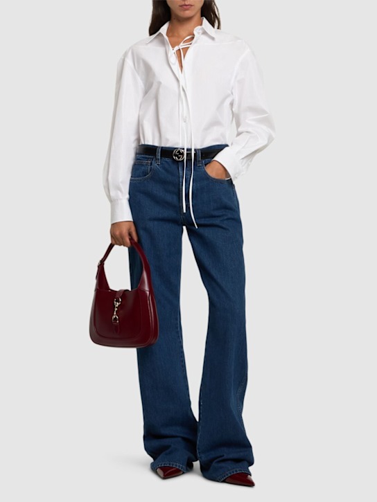 Luisaviaroma Jeans in denim con logo Gucci laserato Presa